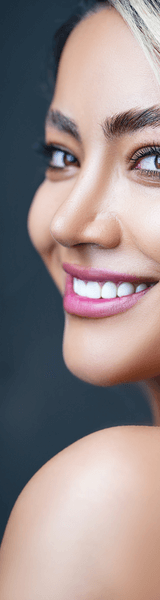 Woman turning around with Invisalign treatment smiling in Stourbridge