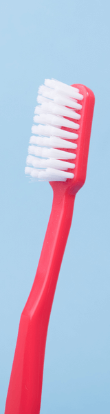 Red toothbrush in Stourbridge used to clean Invisalign aligners