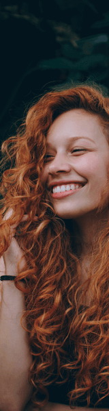 Ginger woman with Invisalign in Stourbridge smiling