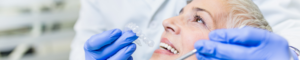 dentist doing invisalign checkup with patient at lion dental in stourbridge