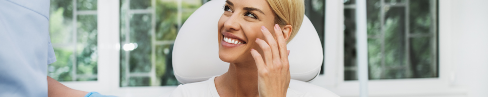 woman sat in dental chair in stourbridge smiling