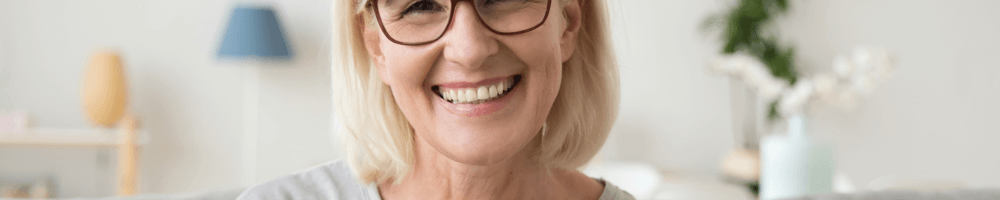 Woman with dental implants in Stoubridge