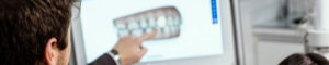Man pointing at 3D teeth scan for invisalign