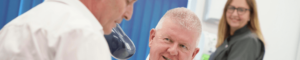 Dentist at Lion Dental in Stourbridge talking with patient about implants