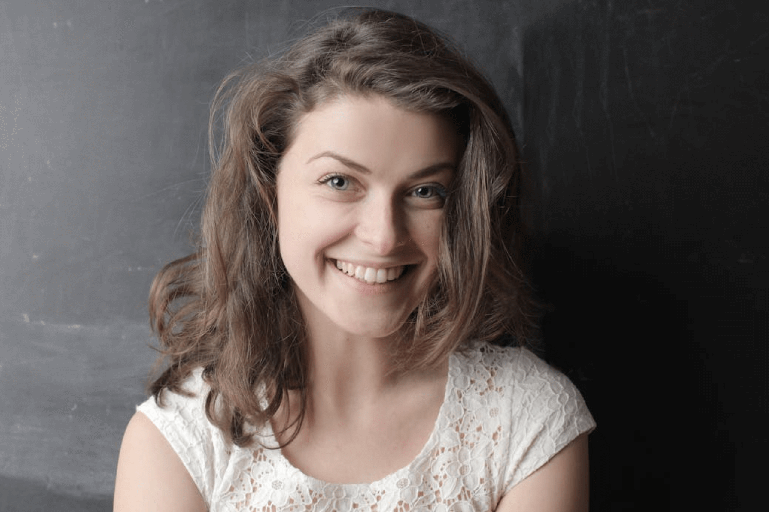woman with implants smiling